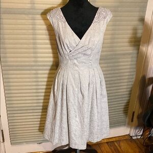 Elegant Creamy White Sleeveless Dress with beading.